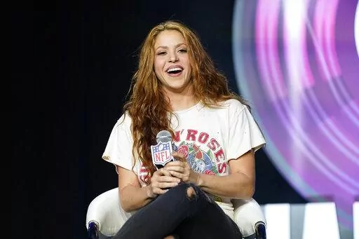 Performer Shakira answers questions at a news conference on Jan. 30, 2020, in Miami. Spanish prosecutors are seeking a prison sentence of eight years for Colombian-born pop star Shakira in her expected trial for alleged tax fraud. Shakira is charged for failing to pay 14,5 million euros ($15 million) in taxes in Spain between 2012 and 2014. Prosecutors say the singer lived in Spain for more than half of each of those years and should have therefore paid her taxes in the country. (AP Photo/David 