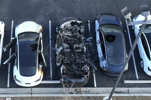 Police are investigating after several vehicles were set on fire at a Tesla service center, Tuesday, March 18, 2025, in Las Vegas. (Bizuayehu Tesfaye/Las Vegas Review-Journal via AP, File)/