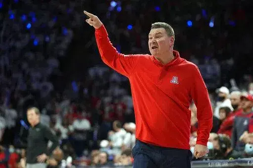 Arizona coach Tommy Lloyd reacts to a play during the second half of the team's NCAA college basketball game against Oregon, Saturday, Feb. 19, 2022, in Tucson, Ariz. Arizona won 84-81. (AP Photo/Rick Scuteri)