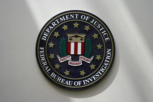 The FBI seal is pictured in Omaha, Neb., Aug. 10, 2022. A Utah man has been charged with threatening a Palestinian rights organization in Washington. The case was unsealed Monday, Nov. 20, 2023, as tensions rise in the U.S. from the devastating war between Israel and Hamas. (AP Photo/Charlie Neibergall, File)