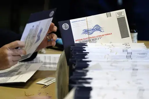 Chester County, Pa., election workers process mail-in and absentee ballots at West Chester University in West Chester, Pa., Nov. 4, 2020. (AP Photo/Matt Slocum, File)