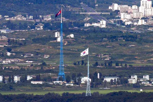 Flags of North Korea, rear, and South Korea, front, flutter in the wind as pictured from the border area between two Koreas in Paju, South Korea, on Aug. 9, 2021. South Korea’s Joint Chiefs of Staff said North Korea fired a ballistic missile toward its eastern waters Friday, Dec. 23, 2022. (Im Byung-shik/Yonhap via AP, File)