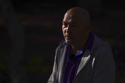 Erbakit Ortabay, 49, an ethnic Kazakh born in Xinjiang, speaks to the Associated Press, in London, Thursday, Oct. 6, 2022. A Uyghur organization and a human rights group are taking the U.K. government to court to challenge Britain’s failure to block the import of cotton products associated with forced labor and other abuses in China’s far western Xinjiang region. Erbakit Ortabay, said he was detained in internment centers, where he was tortured and beaten, and later forced to work for no pay