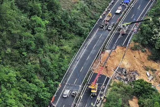 In this photo released by Xinhua News Agency, an aerial photo shows rescuers work at the site of a collapsed road section of the Meizhou-Dabu Expressway in Meizhou, south China's Guangdong Province, Wednesday, May 1, 2024. A section of a highway collapsed early Wednesday in southern China leaving more than a dozen of people dead, local officials said, after the area had experienced heavy rain in recent days. (Xinhua News Agency via AP)