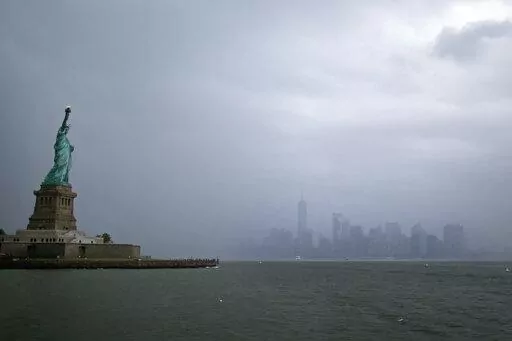The Statue of Liberty is seen with lower Manhattan in the background July 1, 2021, in New York. There are few places in the U.S. with a more deeply ingrained reputation as a refuge for immigrants than New York City, where the Statue of Liberty rises from the harbor as a symbol of welcome for the worn and weary. (AP Photo/Adam Hunger, File)