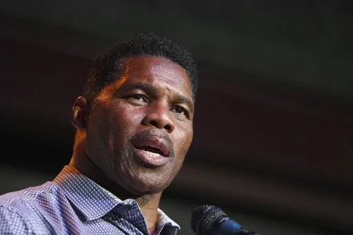 Herschel Walker, Republican candidate for U.S. Senate for Georgia, speaks at a primary watch party on May 23, 2022, at the Foundry restaurant in Athens, Ga. A woman who said Walker paid for her 2009 abortion is the mother of one of his children, according to a new report released Wednesday, Oct. 5, 2022, undercutting the Republican Senate candidate's claims that he did not know who she was. (AP Photo/Akili-Casundria Ramsess, File)
