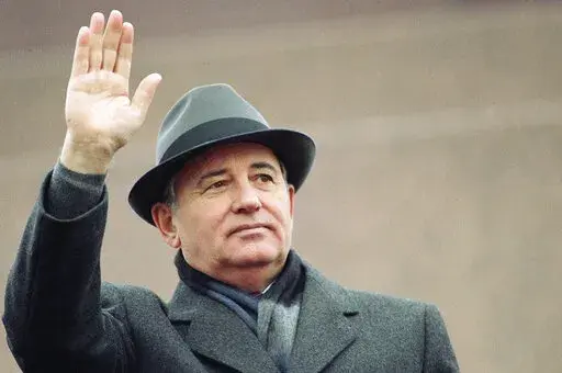 Soviet President Mikhail Gorbachev waves from the Red Square tribune during a Revolution Day celebration, in Moscow, Soviet Union, Tuesday, Nov. 7, 1989. Russian news agencies are reporting that former Soviet President Mikhail Gorbachev has died at 91. The Tass, RIA Novosti and Interfax news agencies cited the Central Clinical Hospital. (AP Photo/Boris Yurchenko, File)
