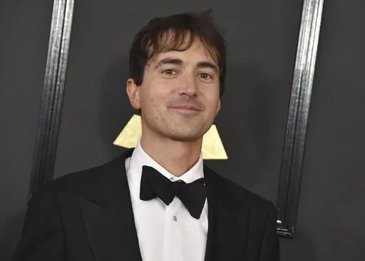 Mason Bates arrives at the 59th annual Grammy Awards at the Staples Center on Sunday, Feb. 12, 2017, in Los Angeles. The Los Angeles Opera scrapped plans for the world premiere of Bates' “The Amazing Adventures of Kavalier & Clay” this fall because of finances, and the work will instead open with a student cast at Indiana University's Jacobs School of Music. (Photo by Jordan Strauss/Invision/AP, File)