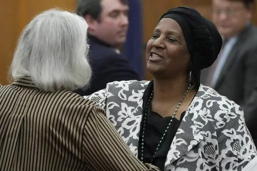 Sabreen Sharrief, right, reaches out to hug fellow plaintiff Dorothy Triplett after testifying at a hearing May 10, 2023, in Hinds County Chancery Court in Jackson, Miss., where a judge heard arguments about a Mississippi law that would allow some circuit judges to be appointed rather than elected. The Mississippi Supreme Court issued a ruling Thursday, Sept. 21, 2023, striking down the part of the law dealing with four appointed circuit judges for Hinds County. (AP Photo/Rogelio V. Solis, File)