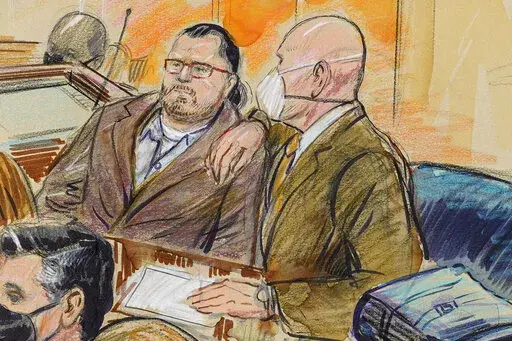 This artist sketch depicts Guy Wesley Reffitt, joined by his lawyer William Welch, right, in Federal Court, in Washington, on Feb. 28, 2022.  Reffitt, convicted of storming the U.S. Capitol with a holstered handgun helmet and body armor was sentenced on Monday to 87 months — more than seven years — in prison. It's the longest sentence imposed so far among hundreds of Capitol riot cases. (Dana Verkouteren via AP, File)