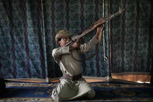 Kahlan, a 12-year-old former child soldier, demonstrates how to use a weapon, at a camp for displaced persons where he took shelter with his family, in Marib, Yemen, July 27, 2018. emen’s Houthi rebels continue to recruit children into their military ranks to fight in the country’s civil war, despite an agreement with the U.N. in April 2022, to halt the practice. Two Houthi officials acknowledged to the Associated Press that the rebels have recruited several hundred children, some as young a