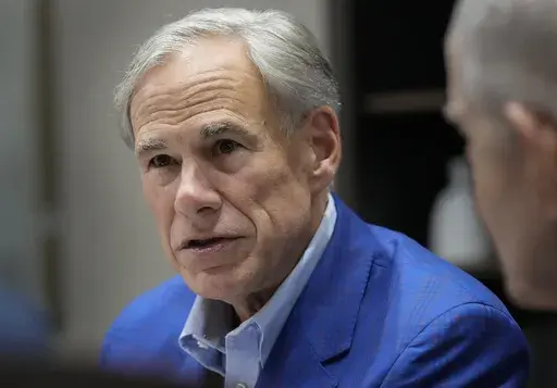 Gov. Greg Abbott receives a briefing for Hurricane Beryl from local elected officials Sunday, July 14, 2024, at Gallery Furniture in Houston. (Yi-Chin Lee/Houston Chronicle via AP)