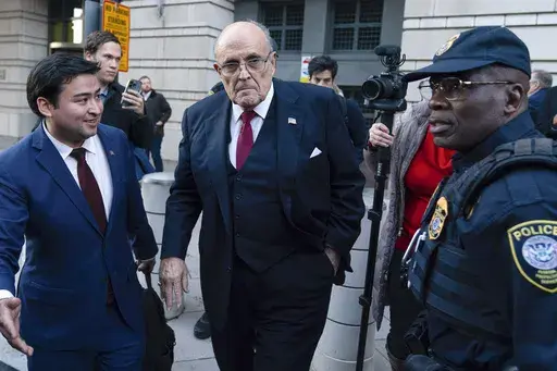 Former Mayor of New York Rudy Giuliani leaves the federal courthouse in Washington, Dec. 15, 2023. (AP Photo/Jose Luis Magana, File)