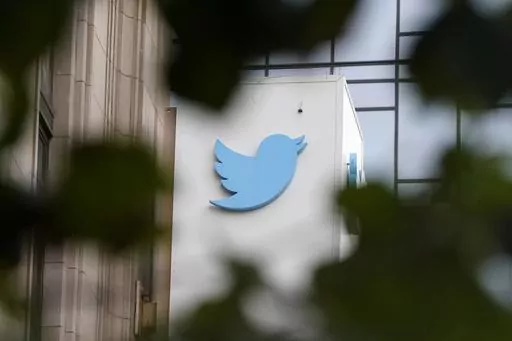 A sign at Twitter headquarters is shown in San Francisco, Dec. 8, 2022. Twitter says it has removed thousands of tweets showing a poster promoting a “trans day of vengeance” protest in support of transgender rights in Washington, D.C., on Saturday, March 25, 2023. (AP Photo/Jeff Chiu, File)
