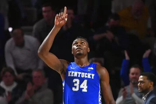 Kentucky forward Oscar Tshiebwe (34) as after an NCAA college basketball game against Vanderbilt comes to an end, Tuesday, Jan. 11, 2022, in Nashville, Tenn. Kentucky won 78-66. (AP Photo/John Amis)