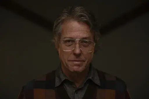 This image released by A24 shows Hugh Grant in a scene from "Heretic." (Kimberley French/A24 via AP)