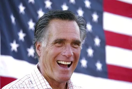 In this June 20, 2018, file photo, Mitt Romney smiles during a campaign event in American Fork, Utah. Mitt Romney isn't up for reelection this year, but his name is surfacing in Republican primaries throughout the nation. Candidates are using the label "Mitt Romney Republican" to frame opponents as insufficiently conservative and enemies of the Trump-era GOP Candidates have employed the concept in attack ads and talking points in Michigan, Ohio and Pennsylvania. (AP Photo/Rick Bowmer, File)