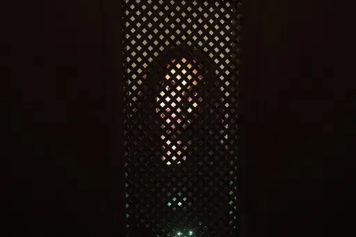 An experimental art installation with an AI Jesus entitled, Deus in Machina, installed in a confessional in St. Peter's Chapel in the old town of Lucerne, Switzerland, Sunday, Aug. 25, 2024. (Urs Flueeler/Keystone via AP)