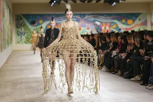 A model wears a creation as part of the Christian Dior Haute Couture Spring Summer 2025 collection, that was presented in Paris, Monday, Jan. 27, 2025. (AP Photo/Lewis Joly).