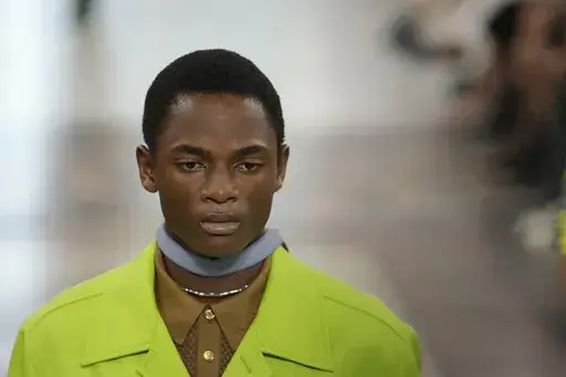 A model wears a creation as part of the Gucci men's Spring Summer 2025 collection, that was presented in Milan, Italy, Monday, June 17, 2024. (AP Photo/Luca Bruno)