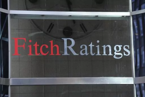 This photo shows signage for Fitch Ratings, Sunday, Oct. 9, 2011, in New York. On Tuesday, Aug. 1, 2023, Fitch Ratings has downgraded the U.S. credit rating, citing an expected increase in government debt over the next three years and a “steady deterioration in standards of governance” over the past two decades. (AP Photo/Henny Ray Abrams, File)