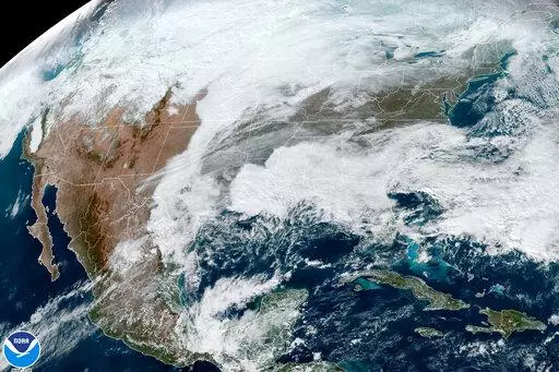 This satellite image made available by NOAA shows cloud cover over North America on Dec. 21, 2022, at 1:31 p.m. The nation’s largest public utility has appointed an independent panel to look into power failures that spurred the decision to implement rolling blackouts during dangerously cold conditions late last year, Tennessee Valley Authority announced Thursday, Jan. 19, 2023. (NOAA via AP, File)