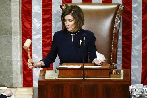 House Speaker Nancy Pelosi of Calif., strikes the gavel after announcing the passage of article II of impeachment against President Donald Trump, Dec. 18, 2019, on Capitol Hill in Washington. (AP Photo/Patrick Semansky, File)