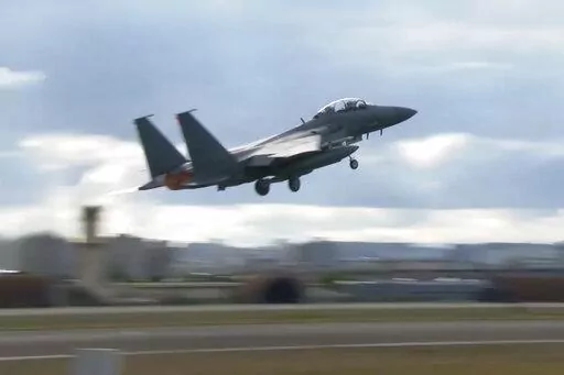 In this image taken from video, South Korean Air Force's F15K fighter jet takes off Tuesday, Oct. 4, 2022, in an undisclosed location in South Korea. South Korea says North Korea flew 12 warplanes near their mutual border on Thursday, Oct. 6, 2022, prompting South Korea to scramble 30 military planes in response. (South Korean Defense Ministry via AP)