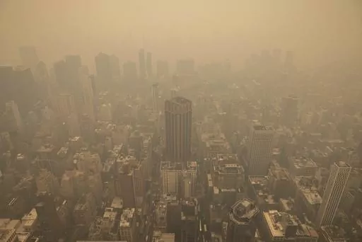 Haze from wildfires in Canada is visible in New York City from the Empire State Building observatory, June 7, 2023, in New York. (AP Photo/Yuki Iwamura, File)