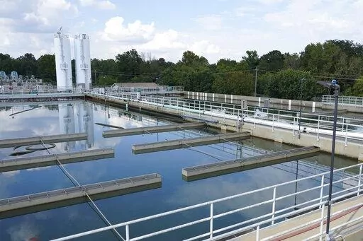 Clouds are reflected off the City of Jackson's O.B. Curtis Water Treatment Facility's sedimentation basins in Ridgeland, Miss., Sept. 2, 2022. As the most populous city in Mississippi attempts to improve its troubled water system, it has appointed a new interim director to lead the agency that runs local infrastructure. (AP Photo/Rogelio V. Solis, File)