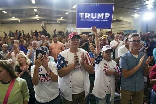 Audience members react during a fundraising event for U.S. Rep. Ashley Hinson, R-Iowa, Sunday, Aug. 6, 2023, in Cedar Rapids, Iowa. (AP Photo/Charlie Neibergall)