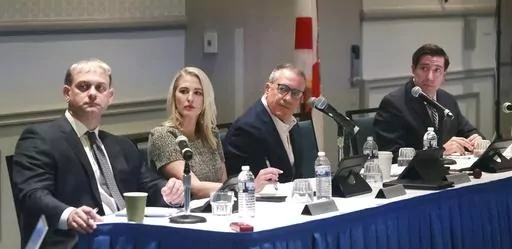Members of the Central Florida Tourism Oversight District Board of Supervisors listen to special general counsel Daniel Langley outline a resolution to invalidate Disney's final agreement with the previous board, the Reedy Creek Improvement District, April 26, 2023. After more than four years of contentious negotiations, the board of Walt Disney World's governing district now made up of Florida Gov. Ron DeSantis appointees approved a contract for its firefighters on Wednesday, July 26, and also 