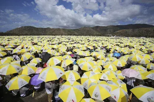 East Timorese crowd Tasitolu park for Pope Francis' Mass in Dili, East Timor, Tuesday, Sept. 10, 2024. (AP Photo/Firdia Lisnawati)