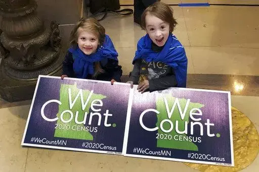 In this April 1, 2019, photo, Noelle Fries, 6, left, and Galen Biel, 6, both of Minneapolis, attend a rally at the Minnesota Capitol to kick off a year-long drive to try to ensure that all Minnesota residents are counted in the 2020 census. Around 1 in 20 residents in Arkansas and Tennessee were missed during the 2020 census. Other U.S. states, including Minnesota, had significant overcounts of their populations, according to figures the U.S. Census Bureau released Thursday, May 19, 2022. (AP Ph