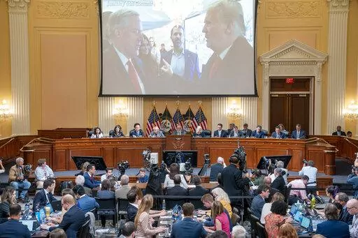 A image of former President Donald Trump talking to his chief of staff Mark Meadows is seen as Cassidy Hutchinson, former aide to Trump White House chief of staff Mark Meadows, testifies as the House select committee investigating the Jan. 6 attack on the U.S. Capitol holds a hearing at the Capitol in Washington, June 28, 2022. (Sean Thew/Pool via AP, File)