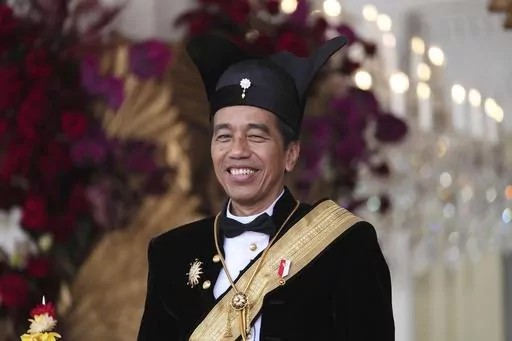 Indonesian President Joko Widodo, dressed in traditional Central Javanese royalty outfit, smiles during a ceremony marking the country's 78th anniversary of independence at Merdeka Palace in Jakarta, Indonesia, on Aug. 17, 2023. Widodo's phenomenal rise from a riverside slum, where he grew up, to the presidency of Indonesia spotlighted how far the world's third-largest democracy had veered from a brutal authoritarian era a decade ago. With his second and final five-year term ending in October, W