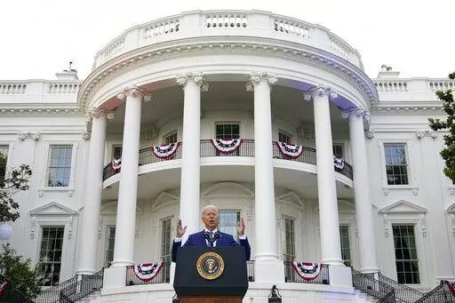 President Joe Biden speaks during an Independence Day celebration on the South Lawn of the White House, July 4, 2021, in Washington. Last Fourth of July, Biden gathered hundreds of people outside the White House for an event that would have been unthinkable for many Americans the previous year. With the coronavirus in retreat, they ate hamburgers and watched fireworks over the National Mall. (AP Photo/Patrick Semansky, File)