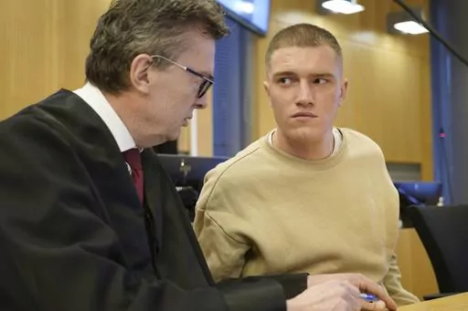 Former member of the Russian private military contractor Wagner Group Andrey Medvedev, right, listens to his lawyer Brynjulf Risnes during a court hearing in Oslo, Tuesday, April 25, 2023. Medvedev, who is seeking asylum in Norway, was Tuesday facing a Norwegian court for a bar brawl earlier this year. Medvedev has confessed to most of the charges for events in February and March but denies violence against police officers who handcuffed him outside an Oslo pub, the Norwegian news agency NTB sai