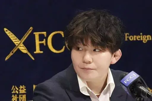 Rina Gonoi, former member of the Japan Ground Self-Defense Forces, attends the press conference at the Foreign Correspondents' Club of Japan, Wednesday, Dec. 13, 2023, in Tokyo. A Japanese court on Tuesday convicted three former soldiers in a sexual assault case that authorities had dropped until Gonoi came forward demanding a reinvestigation and prompting a military-wide harassment probe. (AP Photo/Eugene Hoshiko)