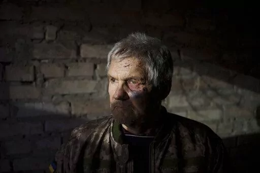 Anatolii Kaharlytskyi, 73, stands inside his house, heavily damaged after a Russian attack in Kyiv, Ukraine, Monday, Jan. 2, 2023. Kaharlytskyi was injured and his daughter in law Iryna died in the attack on Dec. 31, 2022. (AP Photo/Renata Brito)