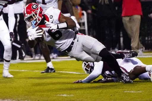 Georgia running back Kenny McIntosh (6) is tackled by a Mississippi State defender as he tries to get into the end zone during the first half of an NCAA college football game in Starkville, Miss., Saturday, Nov. 12, 2022. (AP Photo/Rogelio V. Solis)