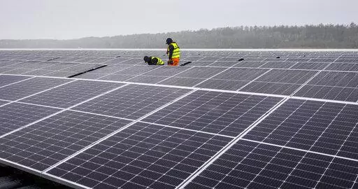 Solar panels are installed at a floating photovoltaic plant on a lake in Haltern, Germany, on April 1, 2022. Russia's Gazprom says it is halting natural gas supplies to Poland and Bulgaria, escalating tensions between the Kremlin and Europe over energy and Russia's invasion of Ukraine — and adding new urgency to plans to reduce and then end the continent's dependence on Russia as a supplier of oil and gas. (AP Photo/Martin Meissner)