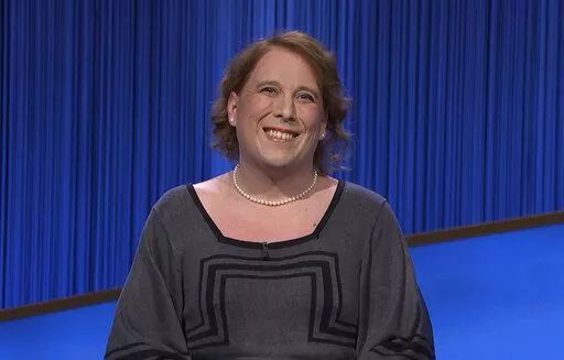 This image provided by Jeopardy Productions, Inc. shows game show champion Amy Schneider on the set of "Jeopardy!" Schneider is the first trans person to qualify for the show's Tournament of Champions. (Jeopardy Productions, Inc. via AP)
