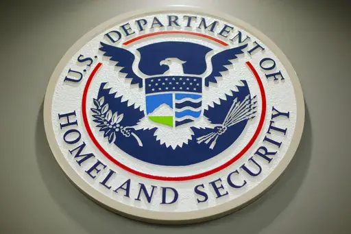 The Department of Homeland Security logo is seen during a news conference in Washington, Feb. 25, 2015. (AP Photo/Pablo Martinez Monsivais, File)