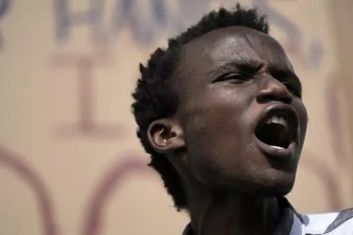 Youth climate activist Eric Njuguna, of Kenya, participates in a demonstration at the COP27 U.N. Climate Summit, Nov. 16, 2022, in Sharm el-Sheikh, Egypt. "I became a climate justice activist out of necessity," the 20-year-old says. "Having seen first-hand the impacts of the climate crisis, I joined the youth climate movement." (AP Photo/Nariman El-Mofty, File)