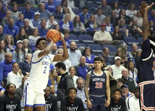 Kentucky's Jaxson Robinson (2) prepares to shoot a 3-point basket while guarded by Jackson State's Dorian McMillian, right, during the first half of an NCAA college basketball game in Lexington, Ky., Friday, Nov. 22, 2024. (AP Photo/James Crisp)
