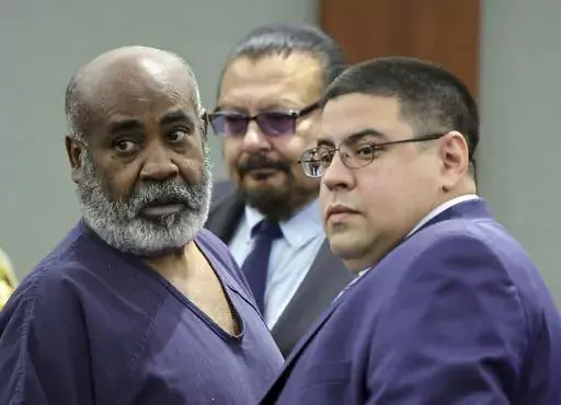 Duane "Keffe D" Davis, left, with deputy special public defenders Robert Arroyo, right, and Charles Cano, rear, appears for his arraignment at the Regional Justice Center, Nov. 2, 2023, in Las Vegas. The former Los Angeles-area gang leader accused of murder in the killing of hip-hop music icon Tupac Shakur in 1996 in Las Vegas is seeking to be released to house arrest ahead of his murder trial in June 2024. A Nevada judge on Tuesday, Dec. 19, 2023, set a Tuesday, Jan. 2, 2024, hearing on the req