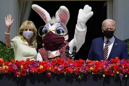 President Joe Biden appears with first lady Jill Biden and the Easter Bunny on the Blue Room balcony at the White House April 5, 2021, in Washington. The White House Easter Egg Roll is returning on April 18, 2022, after a 2-year, COVID-induced hiatus. The Biden's will welcome some 30,000 kids and their adult chaperones for the egg roll, an egg hunt and other activities. (AP Photo/Evan Vucci, File)