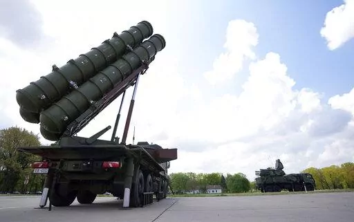 HQ-22 anti-aircraft systems, whose export version is known as FK-3, left, during the military exercises on Batajnica, military airport near Belgrade, Serbia, Saturday, April 30, 2022. Serbia on Saturday publicly displayed a recently delivered Chinese anti-aircraft missile system, raising concerns in the West and among some of Serbia's neighbors that an arms buildup in the Balkans could threaten fragile peace in the region. (AP Photo/Darko Vojinovic)