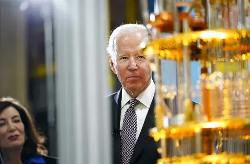 President Joe Biden looks at the IBM System One quantum computer with New York Gov. Kathy Hochul during a tour of an IBM facility in Poughkeepsie, N.Y., on Thursday Oct. 6, 2022. (AP Photo/Andrew Harnik)